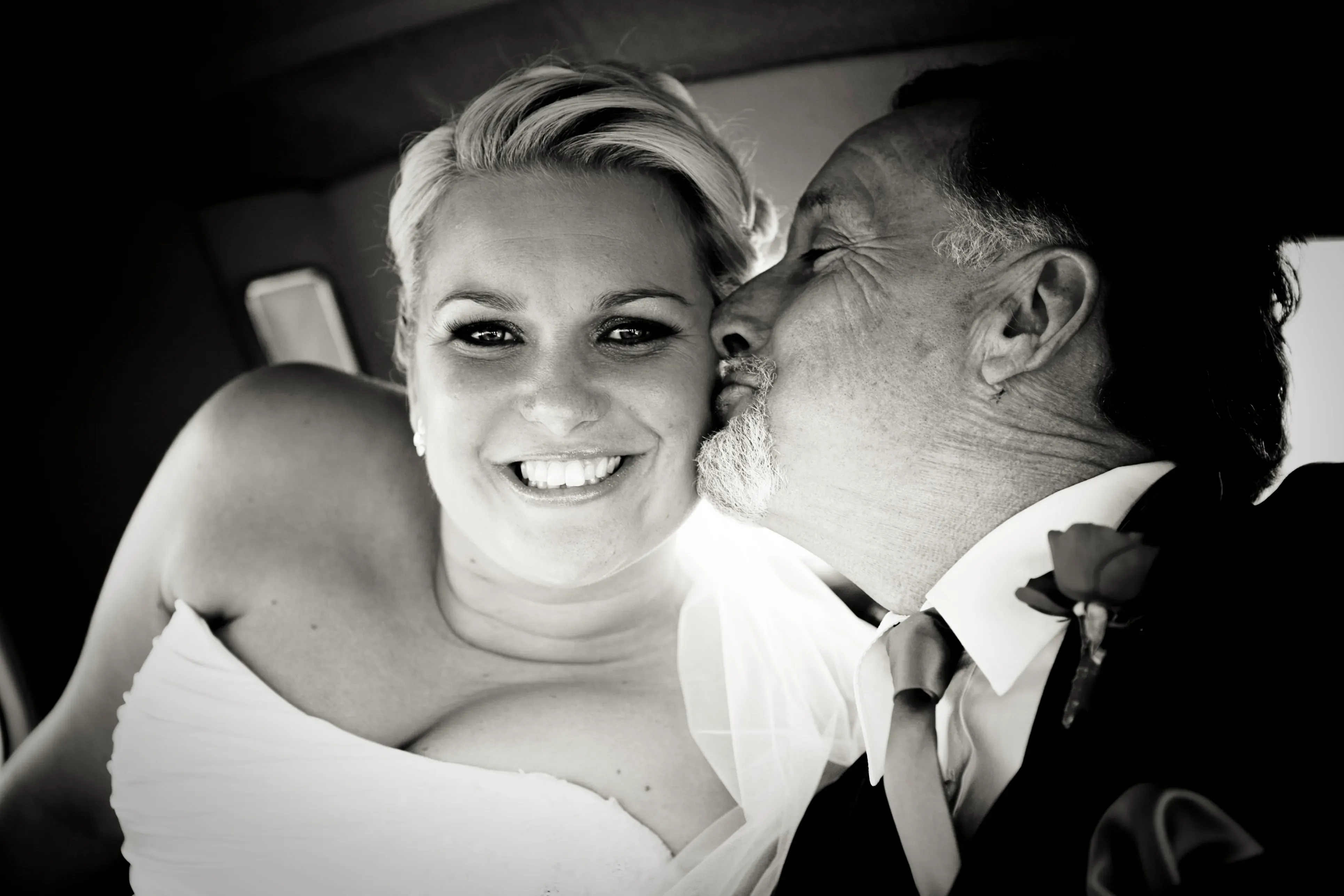 Wedding hair and makeup, the bride with her family after the ceremony