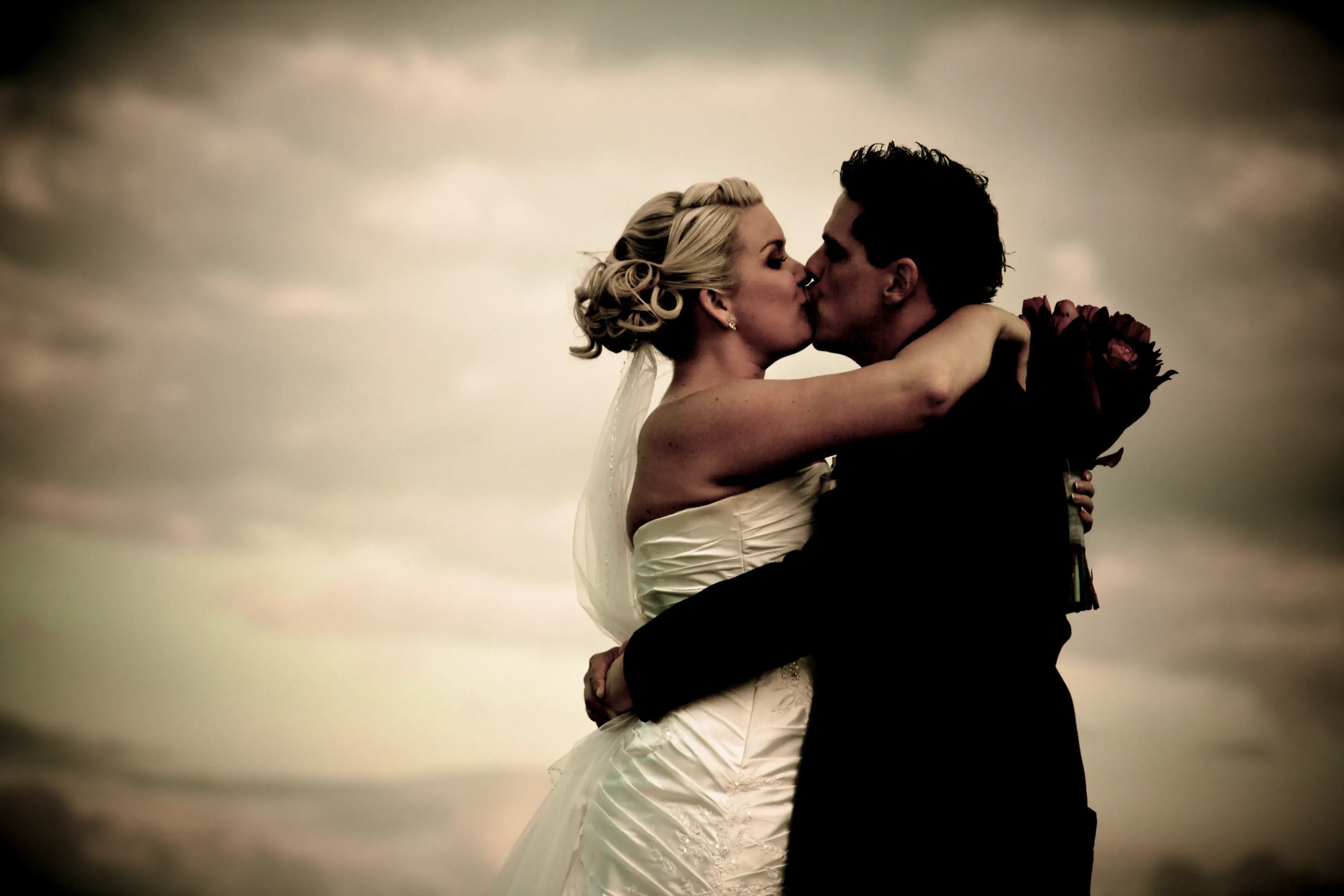 A couple photographed in soft light after their ceremony