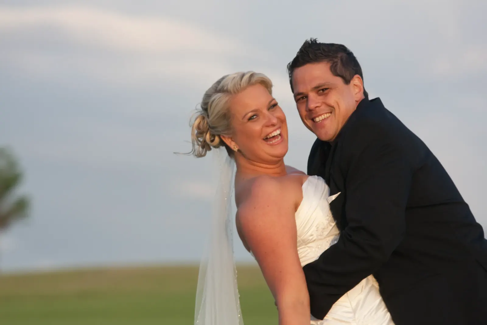 A mother photographed with the couple after the ceremony, hair and makeup by Amanda Frost