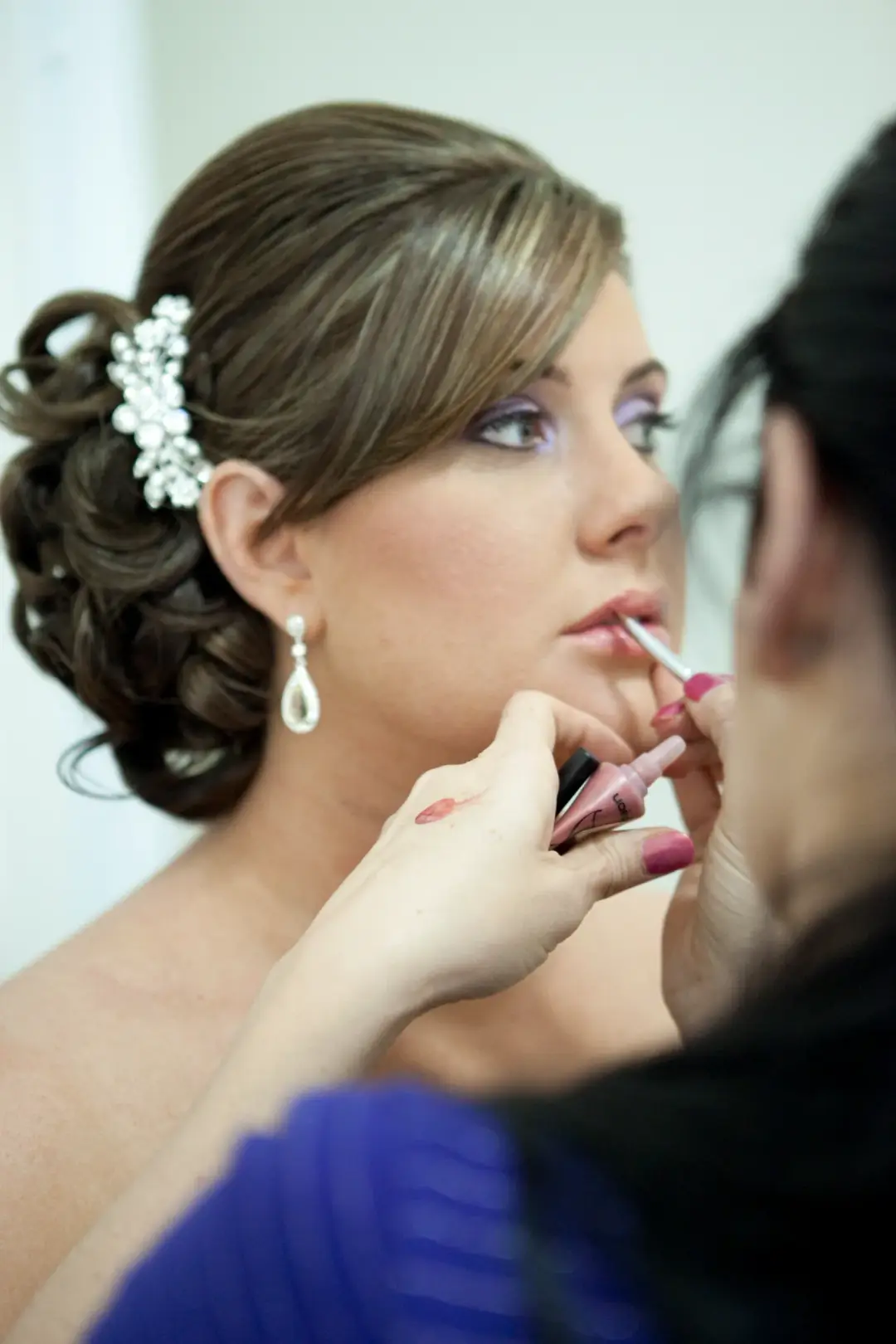 Bridal makeup lip colour application