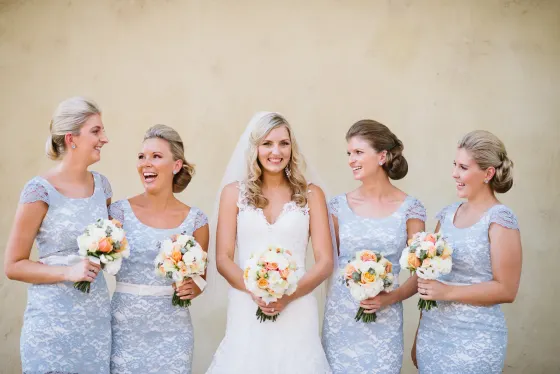 Wedding hair and makeup, the bride and her bridesmaids with their bouquets