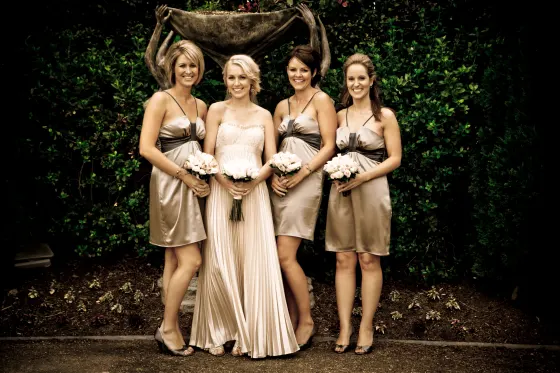 Bridal party hair and makeup, bridesmaids in gold at an evening reception